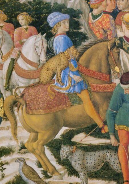 Giuliano de’ Medici depicted with a cheetah behind him on horseback. Painting by Benozzo Gozzoli.